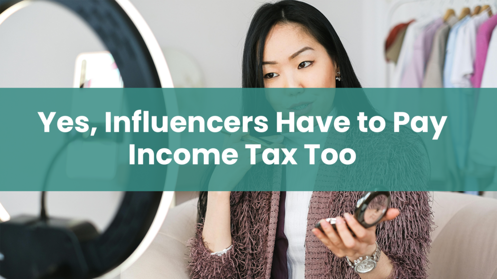 Post title 'Yes, Influencers Have To Pay Income Tax Too' overlaying image of a female influencer shooting beauty and fashion video content